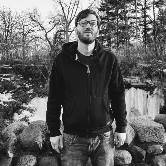 Zack Morgenthaler playing guitar.